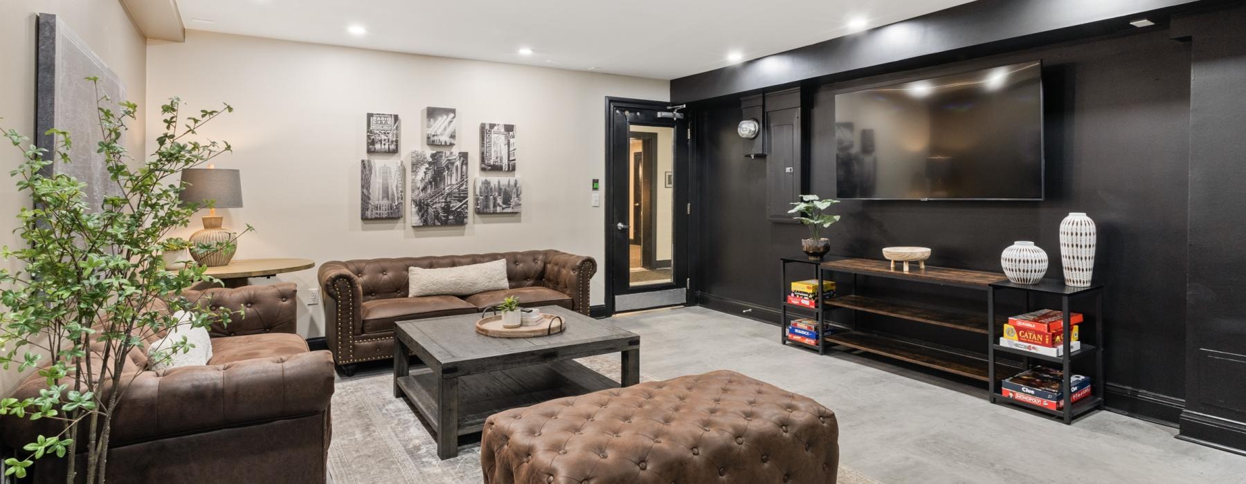 a living room with a coffee table and couches