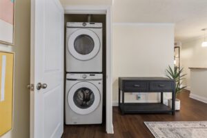 Stacked washer and dryer inside a closet area