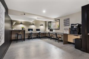 Modern business center with multiple computers and desk areas